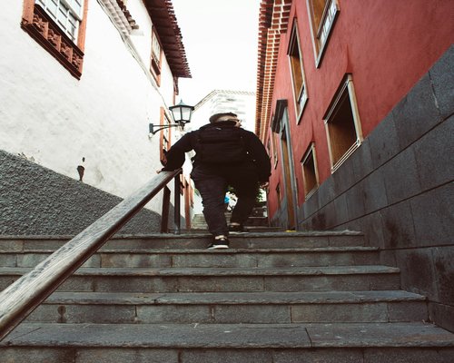 Person walking up public stairs in the city