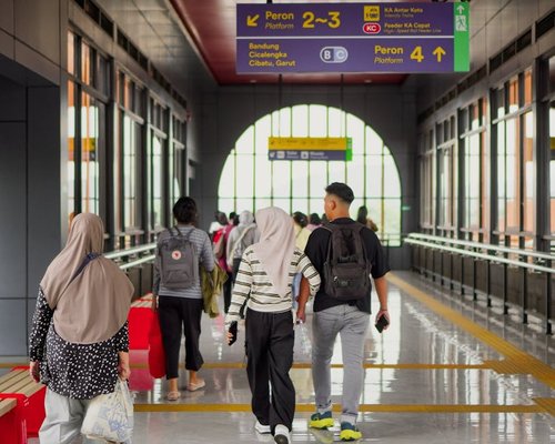 Commuter walking near a transit hub in Indonesia