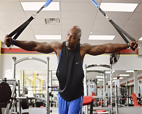 Person stretching arms indoors